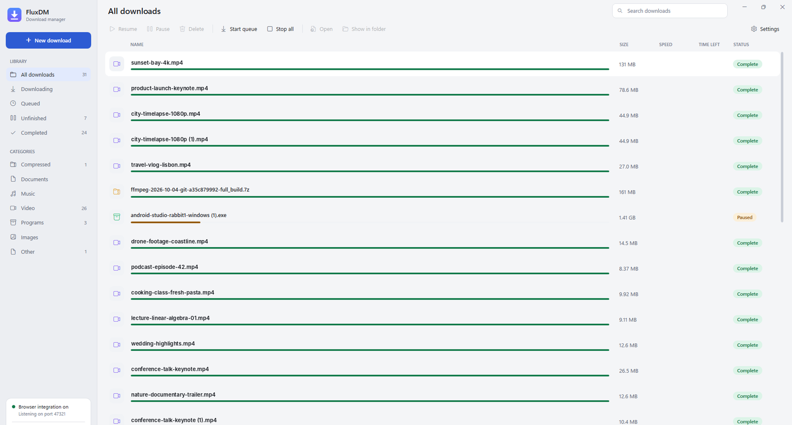 The FluxDM window: a list of downloads with sizes and statuses, and categories down the left side